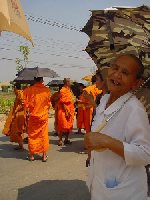 Old woman making the walk to the cremation place